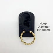 45.0mm 10k gold twisted hoop earring on a black display stand.