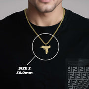 Model wearing the Size 2 gold submachine gun necklace with size measurements.