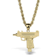 A gold-plated submachine gun pendant necklace on a thick gold rope chain, shown against a plain white background.