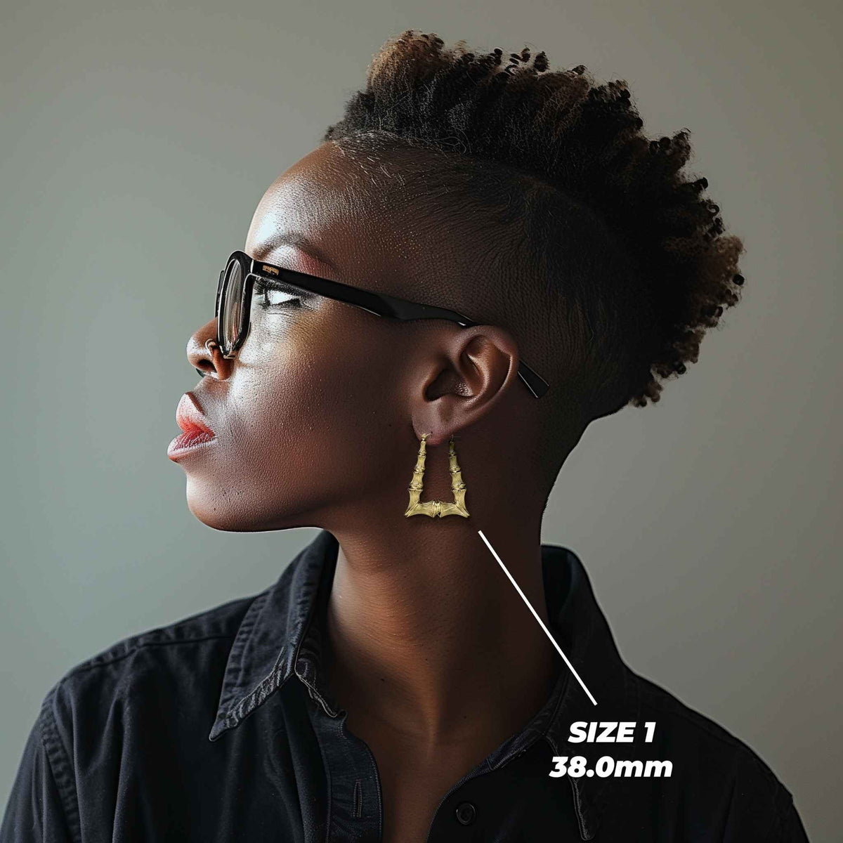 Side profile of a model wearing the 38.0mm Size 1 gold bamboo square hoop.