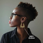 Side profile of a model wearing the 52.0mm Size 3 gold bamboo square hoop.