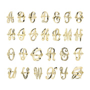Grid display of 10k yellow gold vintage cursive initial rings showing multiple alphabet variants.