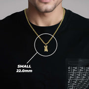 A man wearing a small gold French Bulldog pendant labeled SMALL 22.0mm.