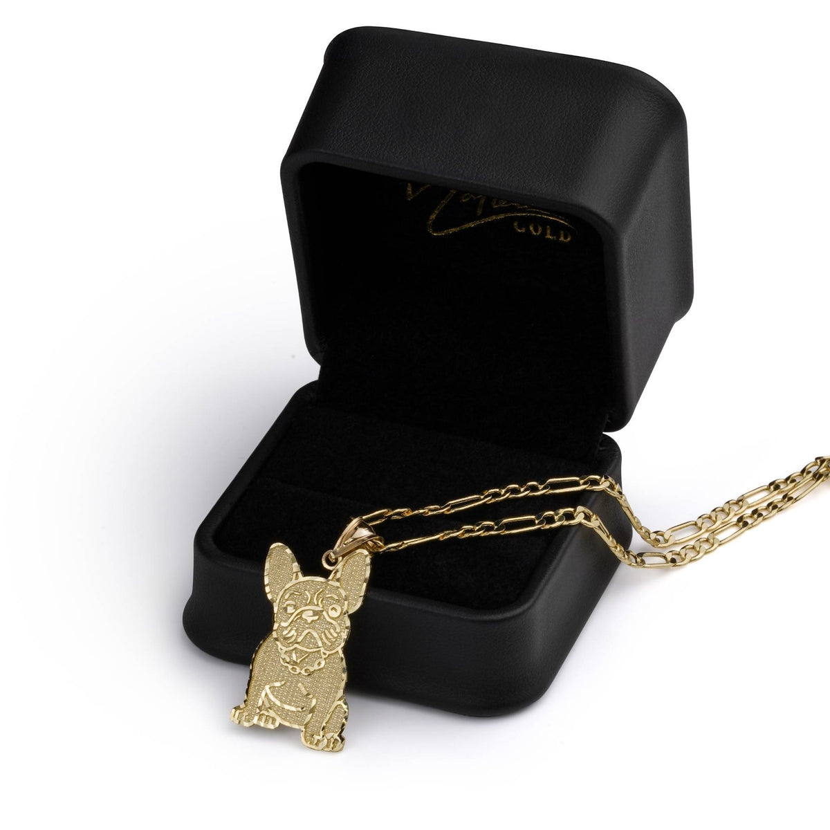 Studio shot featuring the gold dog charm and chain arranged beside a presentation box.