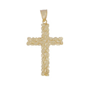 Solid gold religious cross pendant featuring a pebbled nugget finish against white backdrop.
