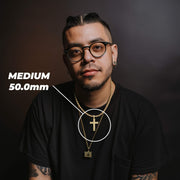 Man wearing the 10k Gold Vintage Nugget Cross Pendant showing Medium 50.0mm dimensions.