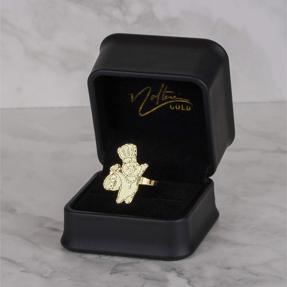 Textured gold Pillsbury Doughboy ring with a diamond-cut finish presented in a jewelry box.