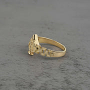 10k gold vintage nugget ring with spade design side view on a gray background
