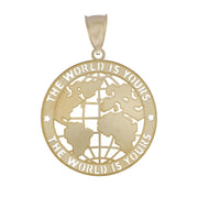 Close-up of a gold world map medallion with engraved text on white.