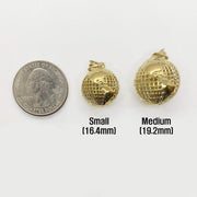 10k yellow gold 3D world globe pendants in Small and Medium sizes beside a US quarter.