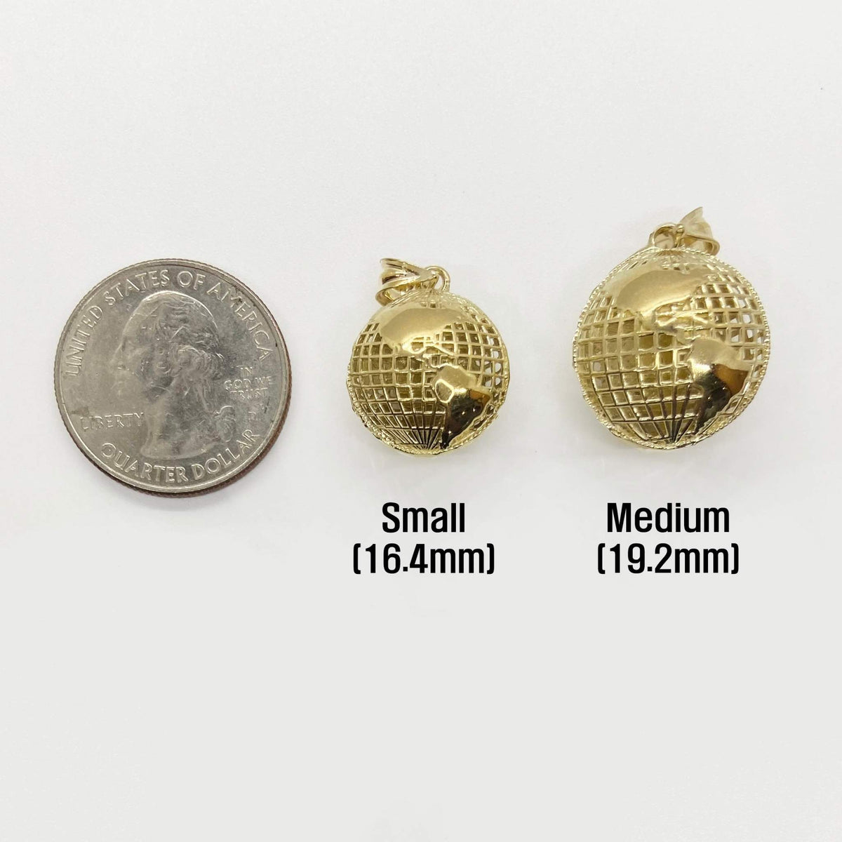 10k yellow gold 3D world globe pendants in Small and Medium sizes beside a US quarter.