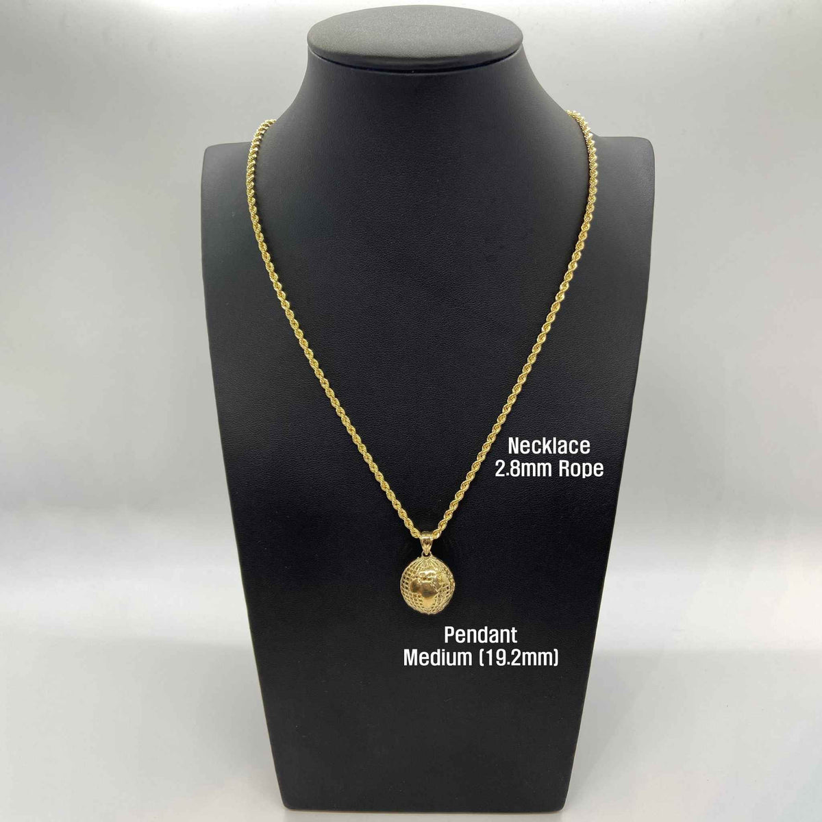 Medium 19.2mm 10k gold 3D world globe pendant on a rope chain on a mannequin.