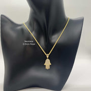 10k gold paved CZ Hamsa hand pendant necklace on a 2.0mm rope chain displayed on a black mannequin bust.
