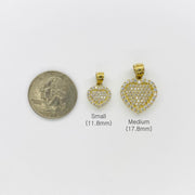 Small and medium 10k gold CZ heart pendants compared in size with a quarter.