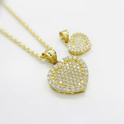 10k gold heart pendant fully encrusted with cubic zirconia stones on a rope chain.