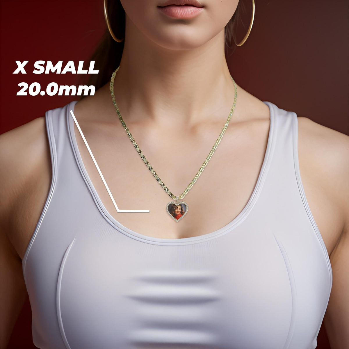 A woman wearing a gold chain necklace with a heart-shaped pendant containing a custom photo.