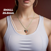 A woman wearing a gold chain necklace with a small 25.0mm heart-shaped memorial picture pendant.