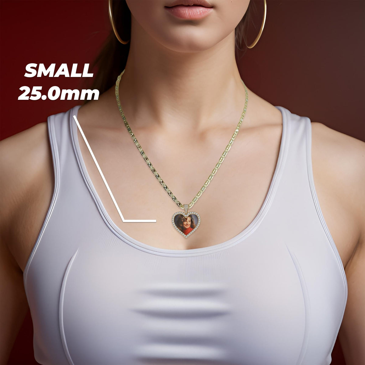 A woman wearing a gold chain necklace with a small 25.0mm heart-shaped memorial picture pendant.