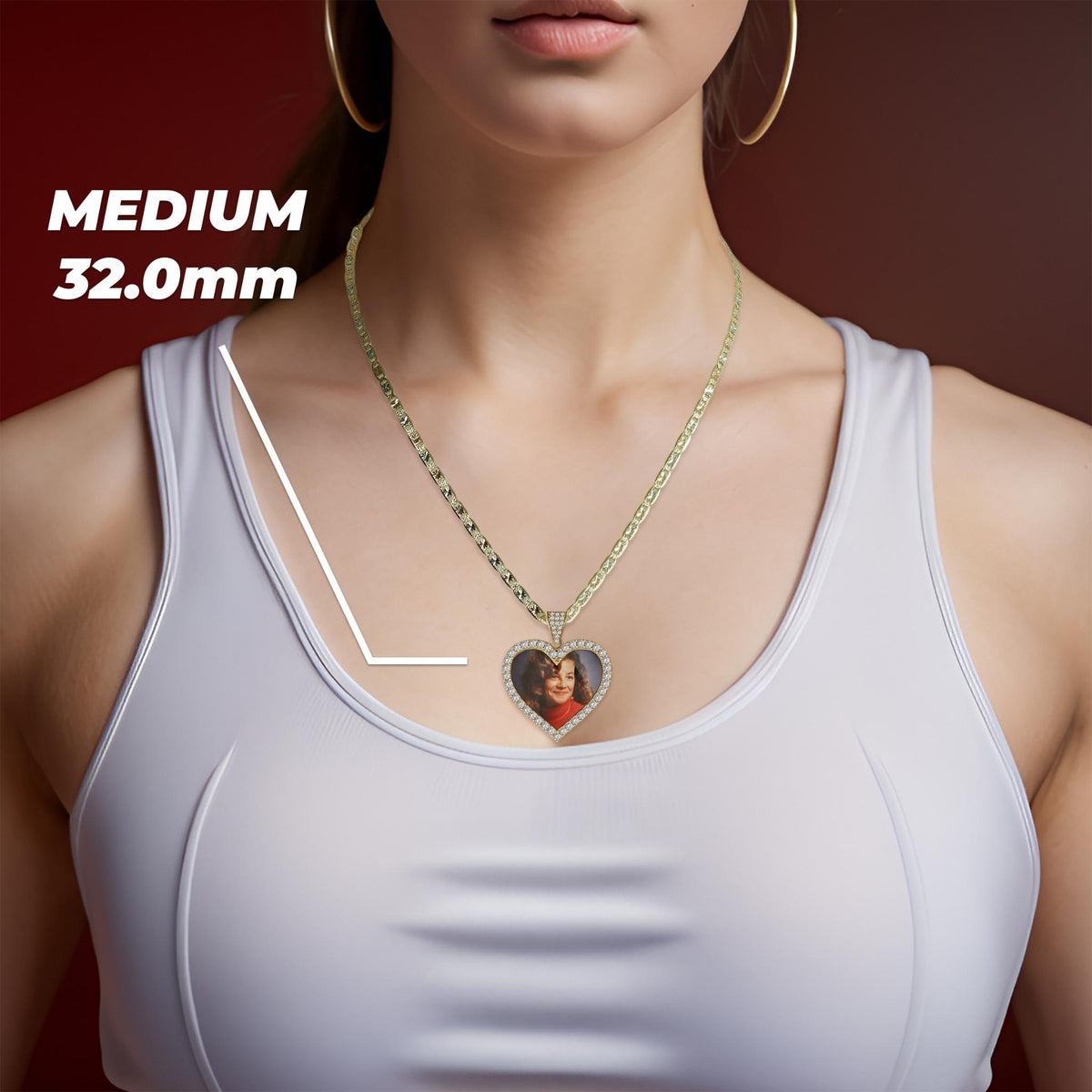 A woman wearing a gold chain necklace with a medium 32.0mm heart-shaped memorial picture pendant.