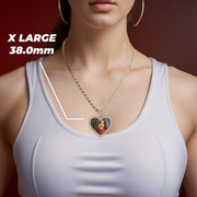 A woman wearing a gold chain necklace with an extra large 38.0mm heart-shaped memorial picture pendant.