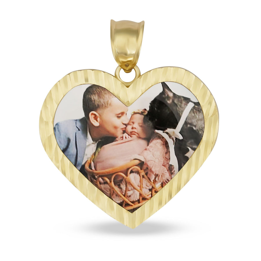 Diamond-cut heart-shaped gold memorial pendant holding a printed photograph of a man kissing a baby.