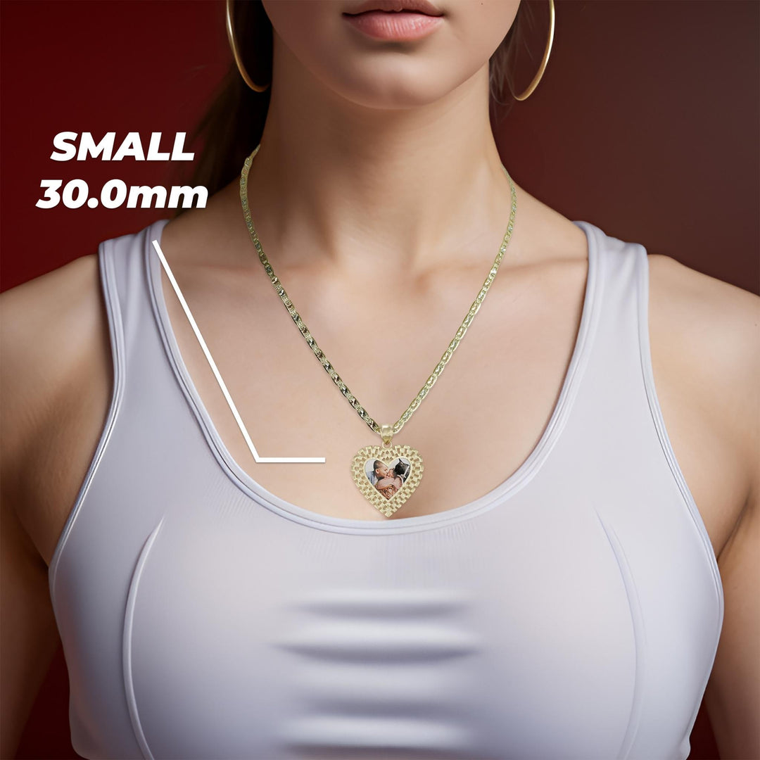 Woman wearing a small 30.0mm gold Rolex-style heart memorial photo pendant necklace on a white top.