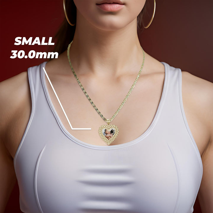 Woman wearing a small 30.0mm gold Rolex-style heart memorial photo pendant necklace on a white top.