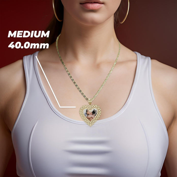 Woman wearing a medium 40.0mm gold Rolex-style heart memorial photo pendant necklace on a white top.