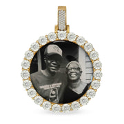 Diamond-cut round gold memorial pendant holding a printed photograph of an elderly couple.