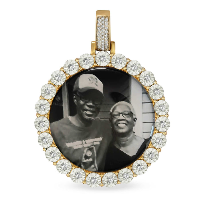 Diamond-cut round gold memorial pendant holding a printed photograph of an elderly couple.