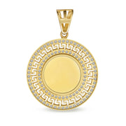 Empty round gold memorial pendant accented with cubic zirconia and a classic Greek key border.
