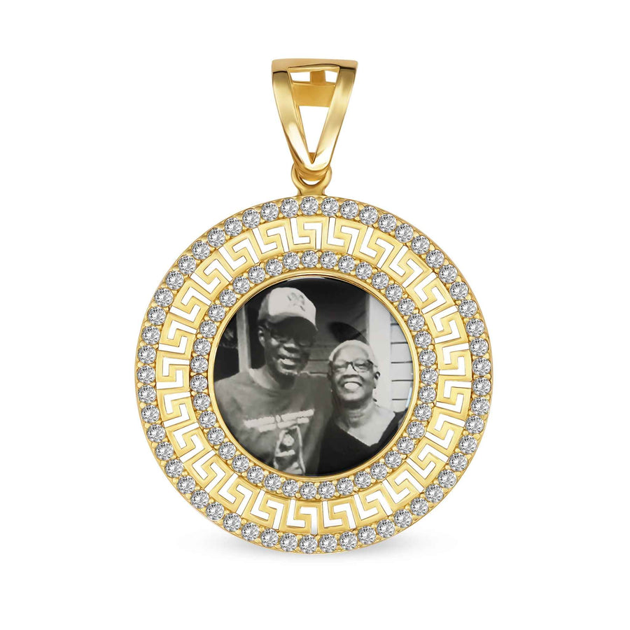Gold round pendant with a Greek key pattern border and a black-and-white memorial photo.