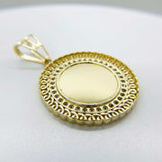 Angled view of a 10k gold round picture pendant with CZ halo.
