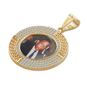 Gold oval pendant with a custom photo, pavé stones, and Greek key border.