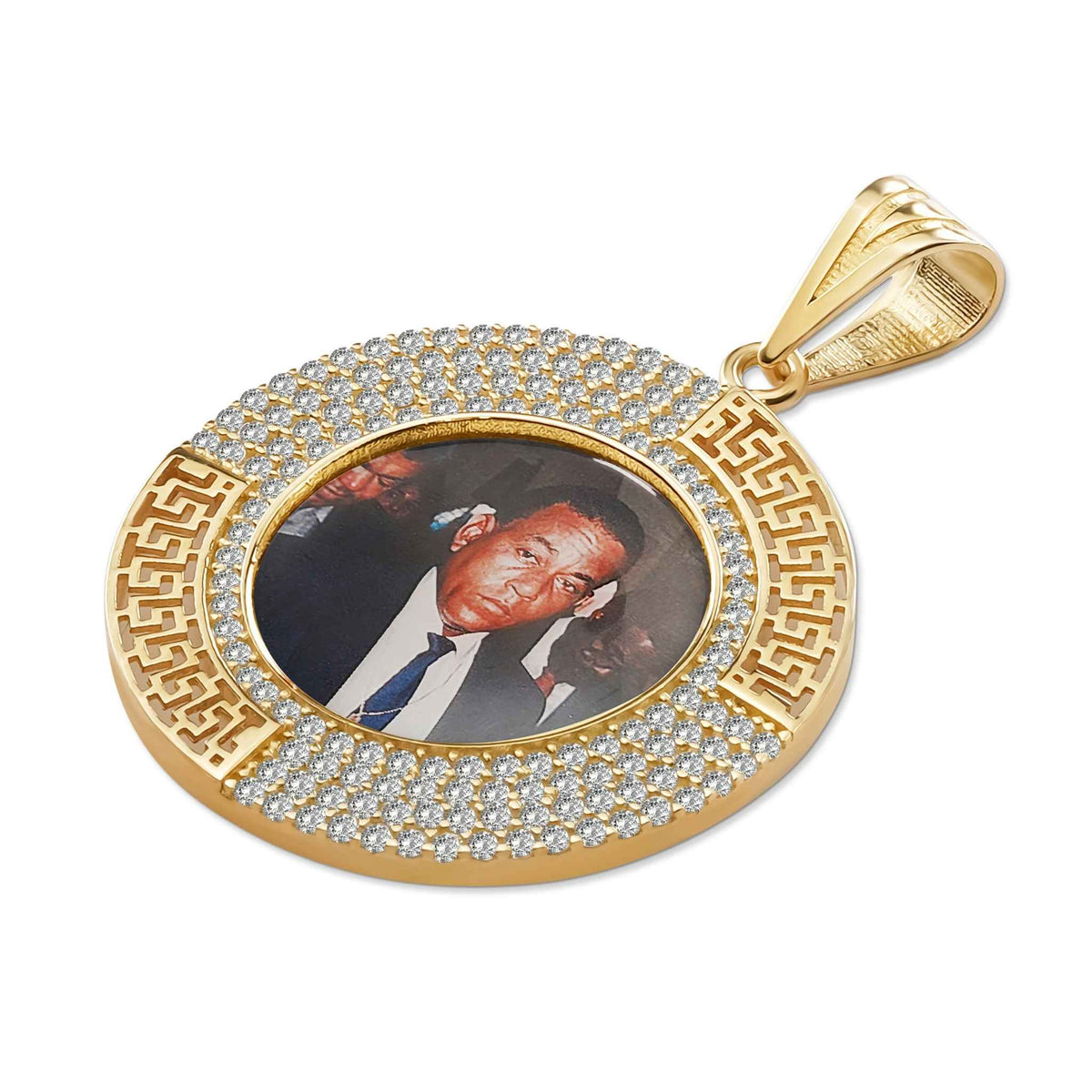 Gold oval pendant with a custom photo, pavé stones, and Greek key border.