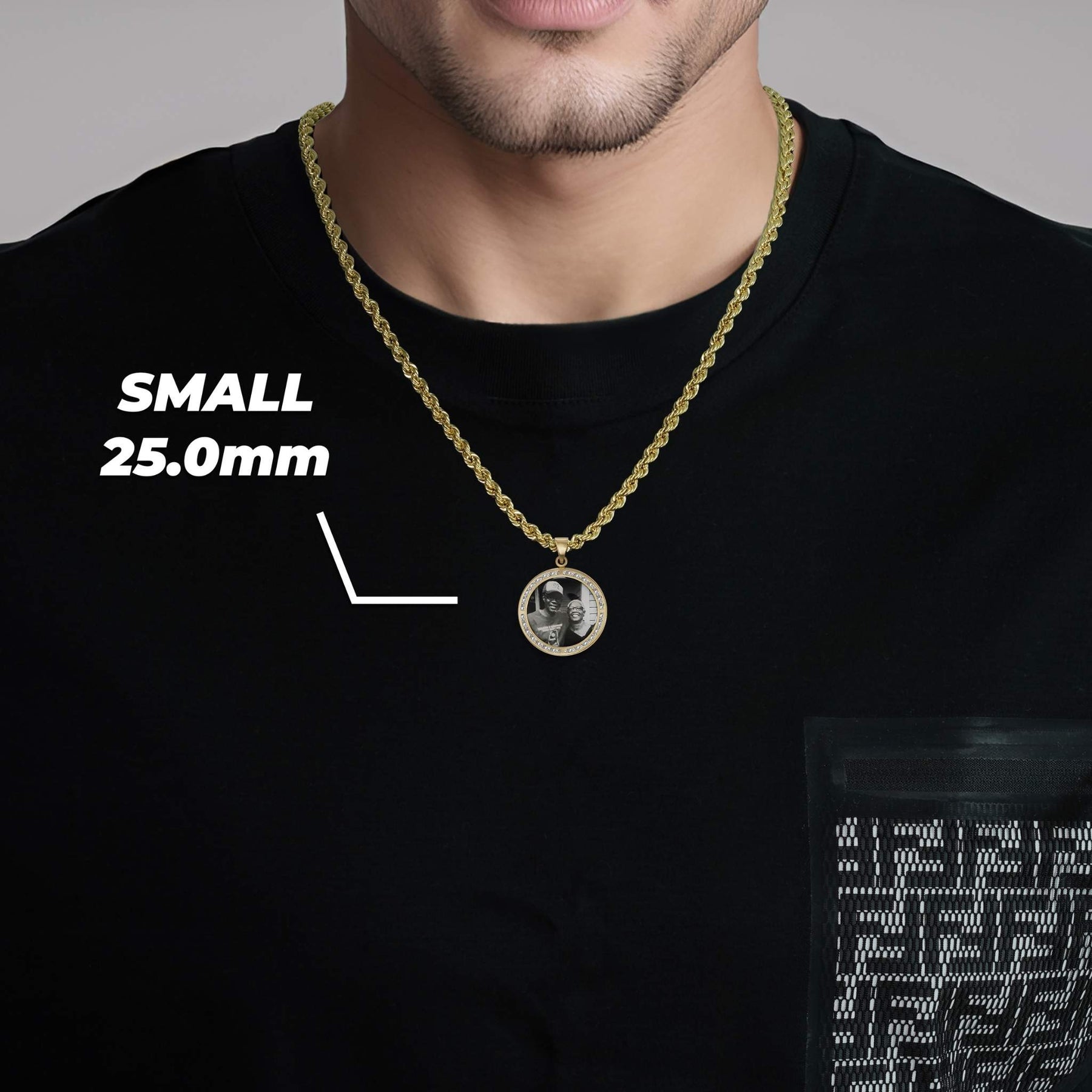 Man wearing a small 25.0mm gold round memorial photo necklace.