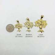Size comparison of small, medium, and large 10k gold money bag tree pendants beside a quarter.