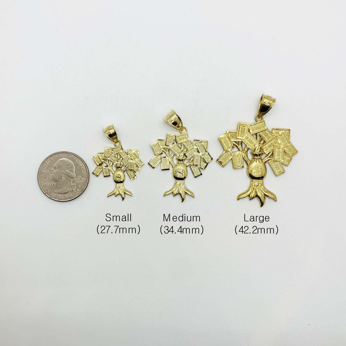 Size comparison of small, medium, and large 10k gold money bag tree pendants beside a quarter.