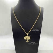 Medium 34.4mm 10k gold money tree pendant on a 3.2mm rope chain shown on a mannequin.