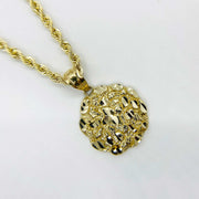Front view of 10k gold round nugget pendant featuring textured surface on rope chain.