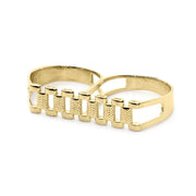 Side-angle perspective of a gold double-finger ring highlighting the twin inner bands.