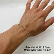 2.2mm width 10k gold pave curb chain bracelet on wrist with measurement overlay text