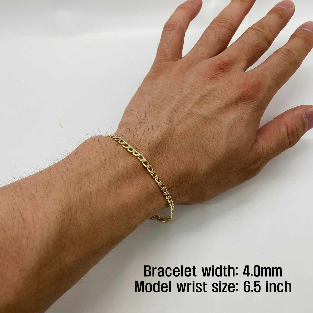 4.0mm width 10k gold pave curb chain bracelet on wrist with measurement overlay text.