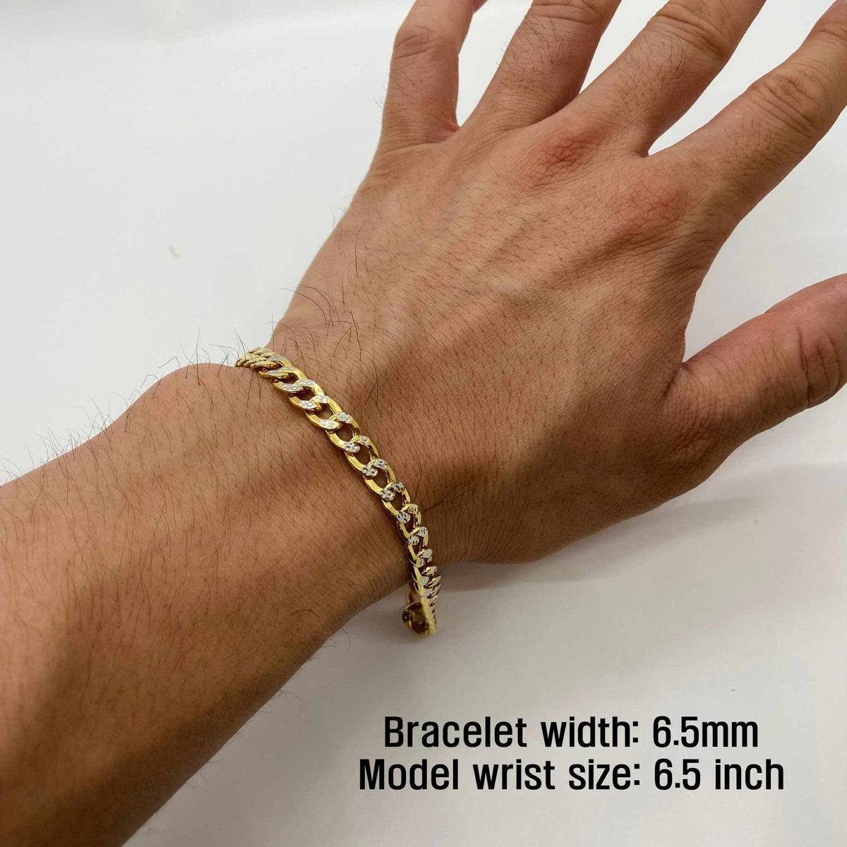 6.5mm width 10k gold pave curb chain bracelet on wrist with measurement overlay text.