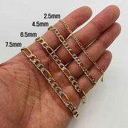 Hand displaying 10k gold pave Figaro chain bracelets ranging from 2.5mm to 7.5mm.