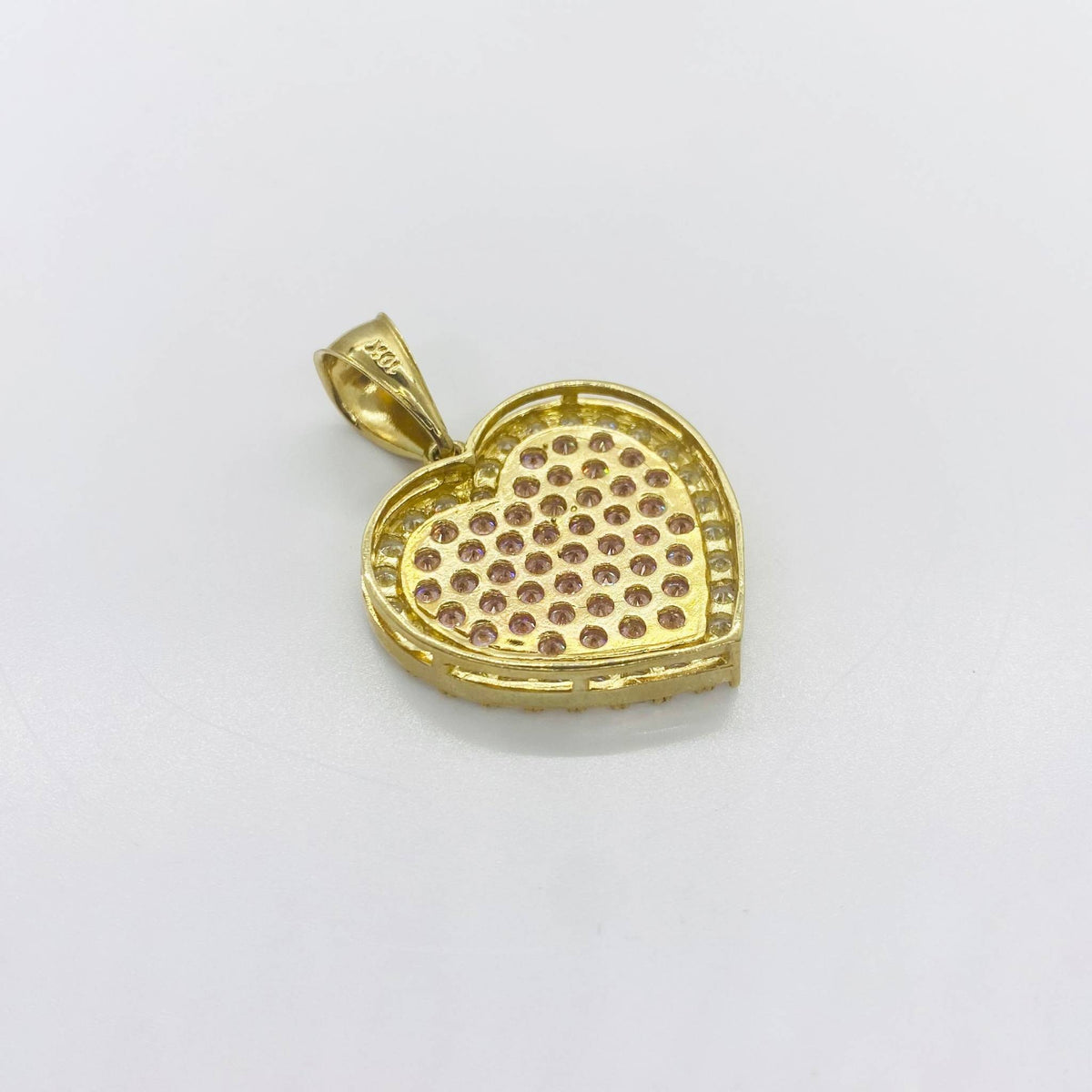 Back view of yellow gold heart pendant showing paved stone setting structure and bail stamp