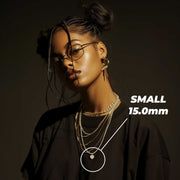 Small 15.0mm pink CZ gold heart pendant necklace worn on model.