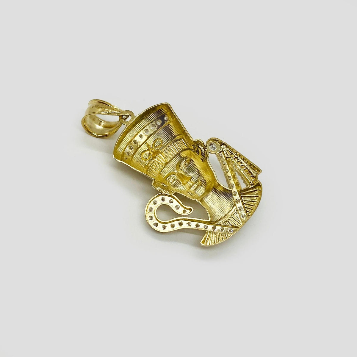 Back view of 10k gold Queen Nefertiti CZ pendant showing textured hollow backing and bail design.
