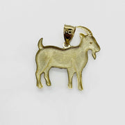 Rear view of a 10k gold goat pendant showing the hollow back design.