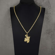 10k gold Pillsbury Doughboy pendant necklace displayed on a black jewelry mannequin bust.